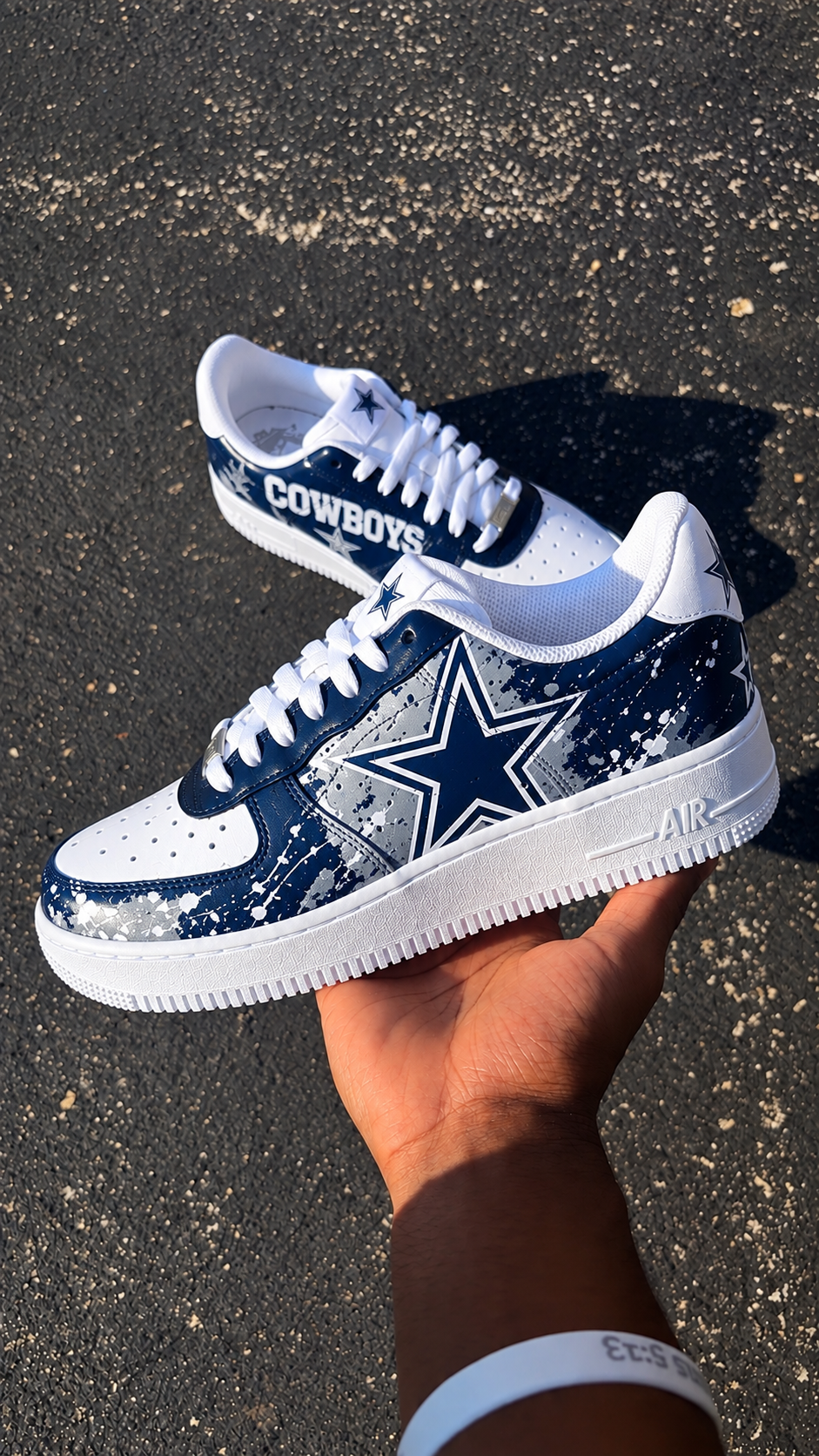 A pair of Dallas Cowboys themed low-top sneakers