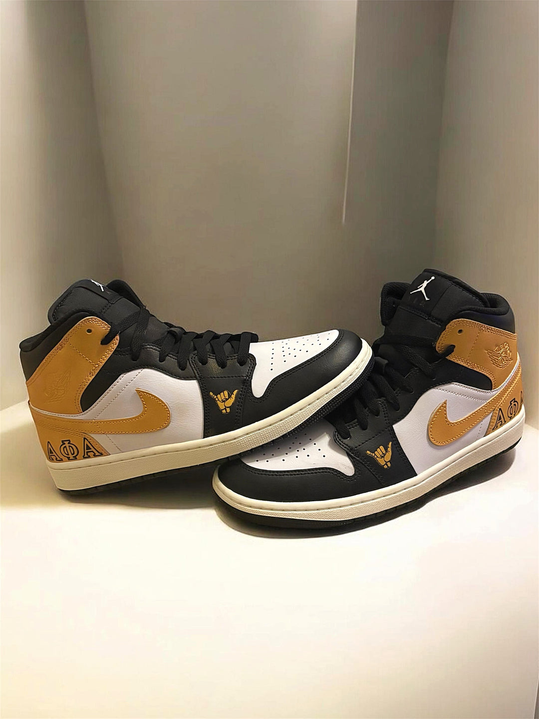 Custom alpha phi alpha air jordan mids. Black and gold design for men’s sneakers 