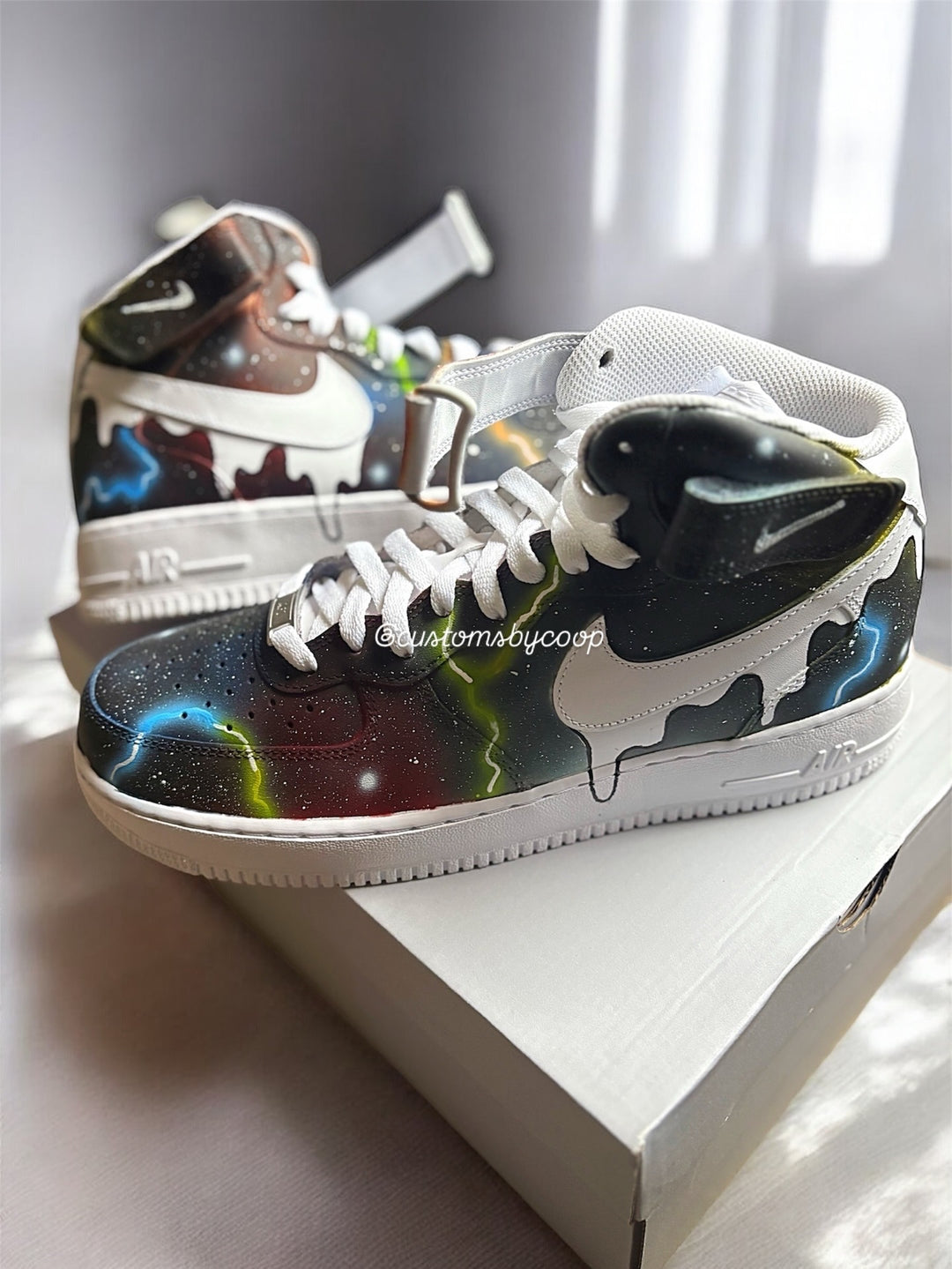 Colorful hightop sneakers with abstract galaxy design on a white Airforce ones. Customs designed for men and women 