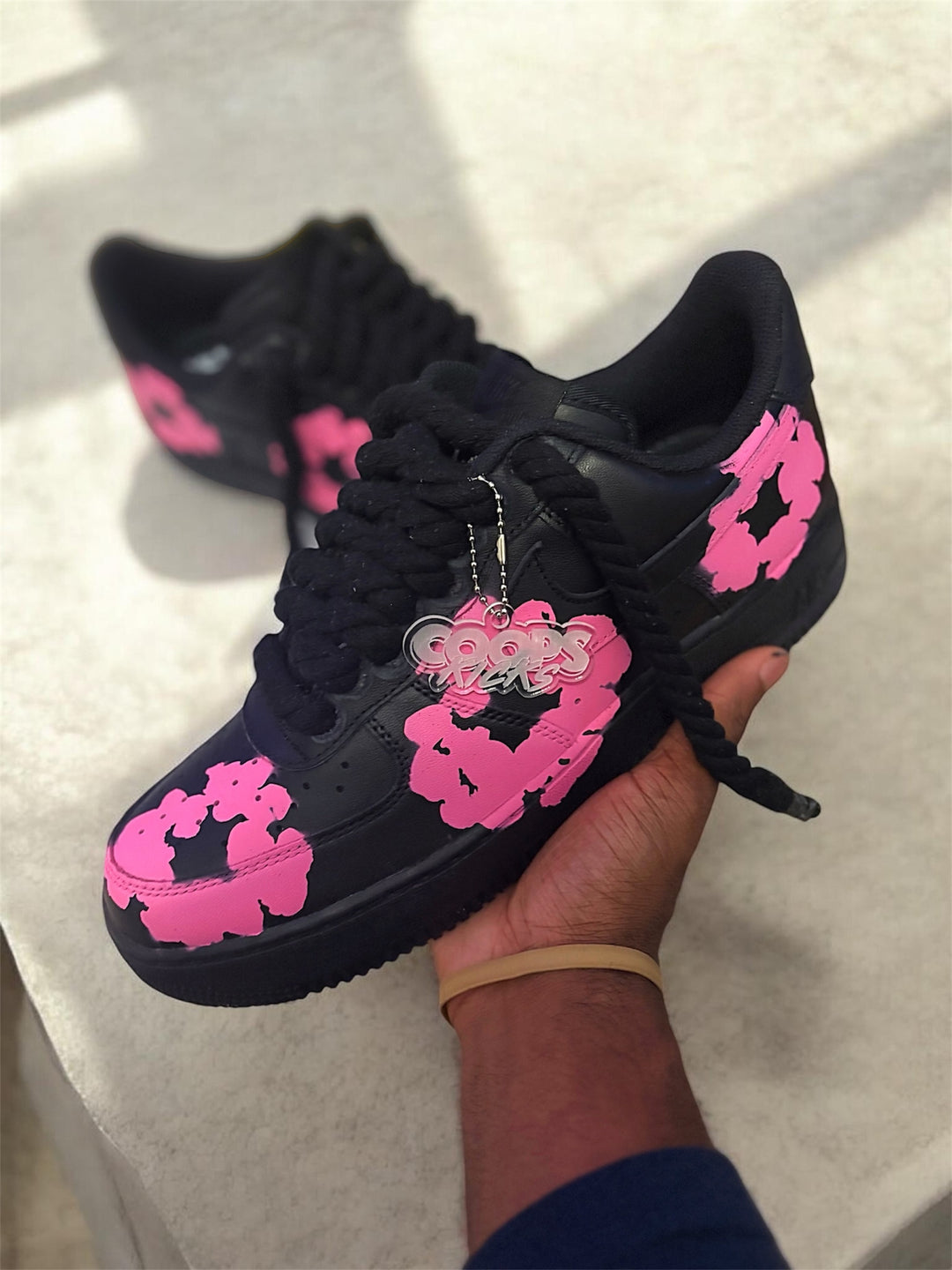 Custom Black sneakers with pink floral designs for men and women 