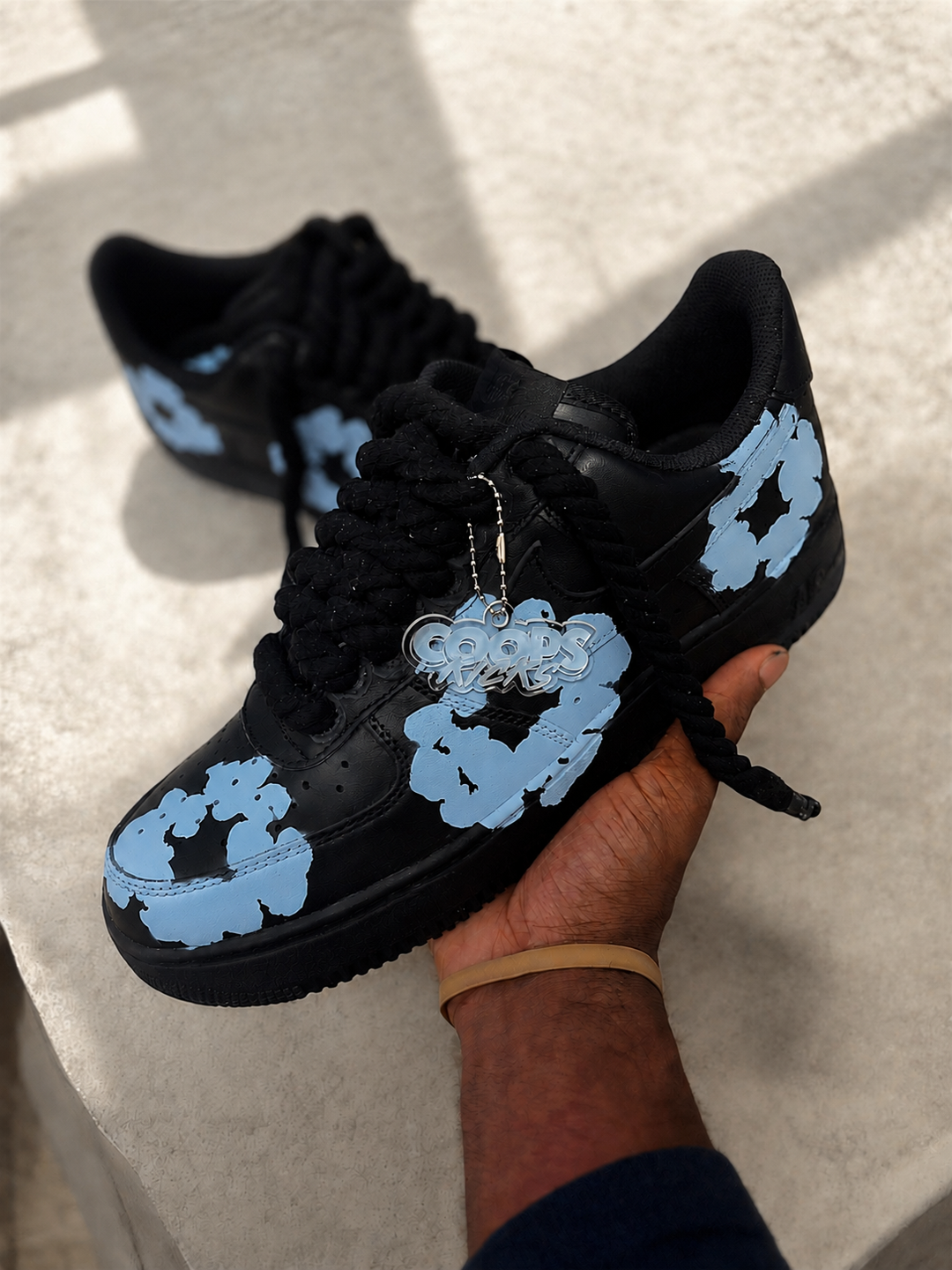 Custom black AF1s with light blue denim tears design. For men and women 